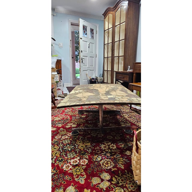 This mid-century modern coffee table is a one of a kind. It was made in 1969 by the artist who delivered it to my mother....