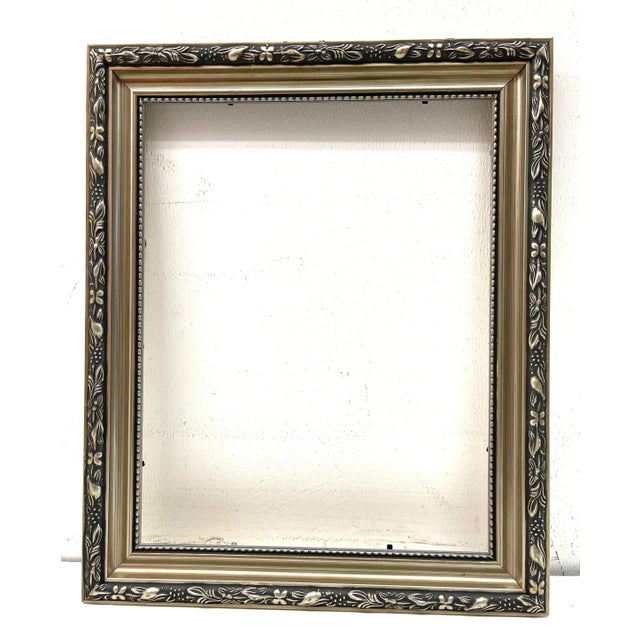 Italian Silver Wood Picture Frame Ornate carved, silver finish over real wood hooks Dimensions: 14” x 17” / inner 10.5” x...