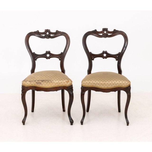 Pair of Victorian Silk Upholstered Walnut Side Chairs. 32" H x 17.5" W x 18.5" D; seat: 18" H. Provenance: The Estate of...