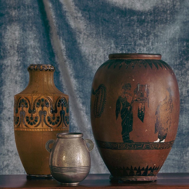 A mid-century French ceramic vase signed 'O. de Lamazieres'. The tall, tapered form rises to a narrow neck, its surface...