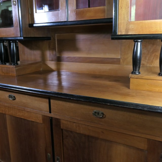 Veneered Viennese cherry wood buffet cabinet in Biedermeier style, early 20th century. It features four free-standing,...