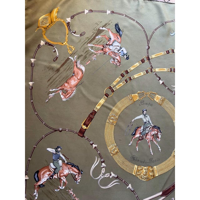 HERMES PAMPA khaki green silk scarf 1986 This scarf celebrates the world of cowboys, more specifically the world of the...