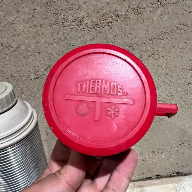 AMBIANIC presents 1970s Vintage Ribbed Thermos Retro Camp Gear USA Quart size thermos with red cup. Stamped. Insulated....