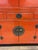 Design Plus Gallery presents a Two Piece Vintage Asian The cabinet is lacquered in a china red color with dark brass...