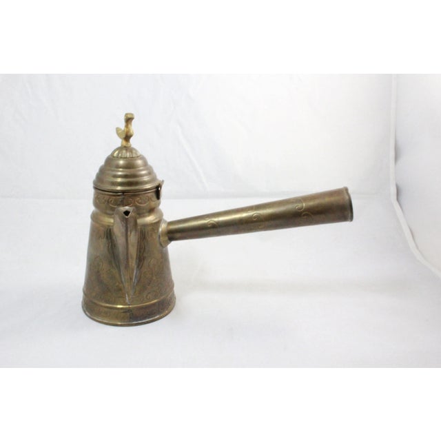 Immerse yourself in the exotic beauty of this exquisite Turkish coffee and tea set crafted meticulously from brass,...