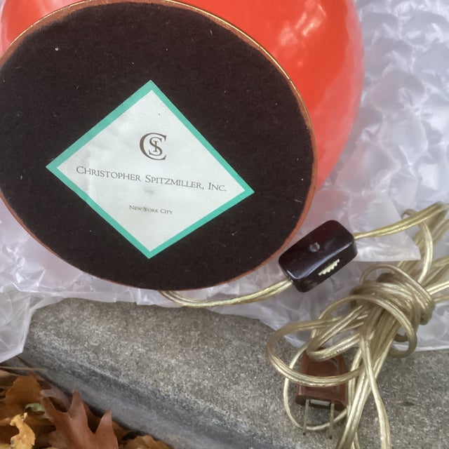 A striking pair of authentic Christopher Spitzmiller double gourd lamps in the highly sought-after Coral glaze. The...