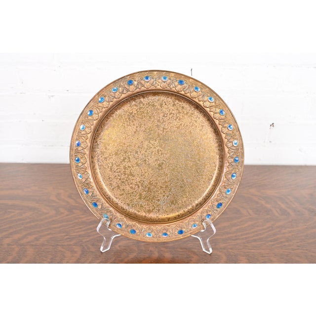 A gorgeous Arts & Crafts or Art Deco period gilt bronze charger plate with enameled jewel decoration By Louis Comfort...