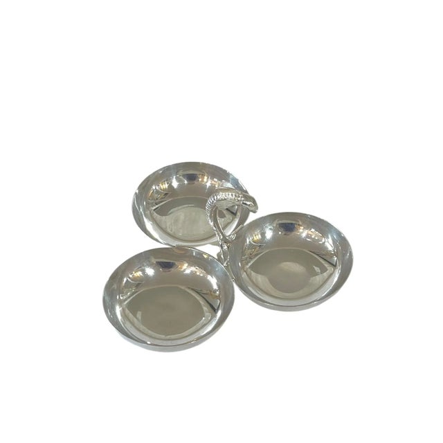 Vintage French silver plate nut dish with Dolphin form handle. Three bowls attached in the center. This piece is not...