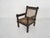 Beautifuly carved wooden lounge chair with rope seating and back.