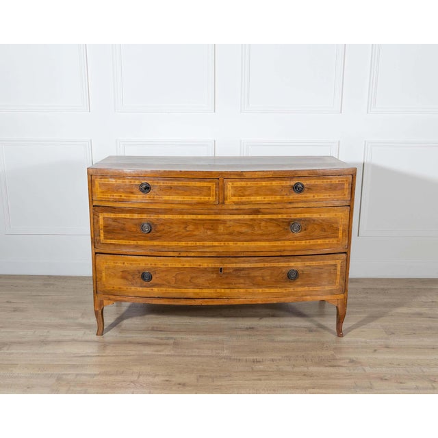 Elegant Venetian Louis XVI chest of drawers crafted in walnut, dating to the 18th century. With its soft bow-front profile...