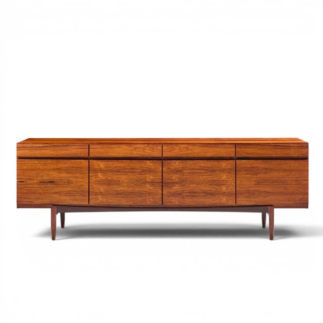 Kofod Larsen for Faarup Møbelfabrik Mid Century Danish Rosewood Credenza This credenza measures: 90.5 wide x 19.5 deep x...