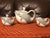 Bring a splash of whimsical nautical charm to your tea service or shelf styling with this vintage three-piece ceramic...
