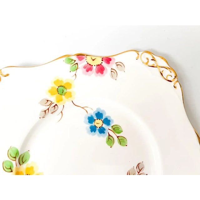 This vintage Royal Tuscan bone china cookie plate features a charming floral pattern in multicolor with gold trim,...
