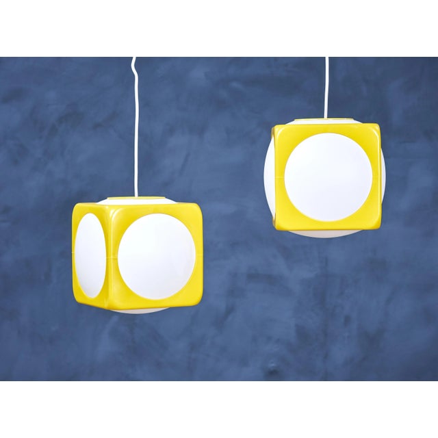 This beautiful lamp makes you think of a dice with the square shape and the yellow and white colors - which also is the...