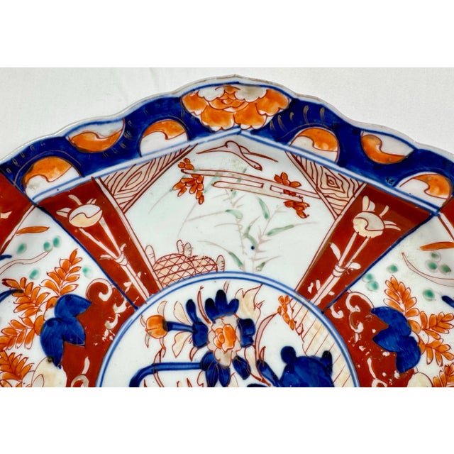 Japanese Large Antique Octagonal Scalloped Edge Porcelain Imari Plate Decorated With Vibrant Orange & Red Floral Patterns For Sale - Image 3 of 10