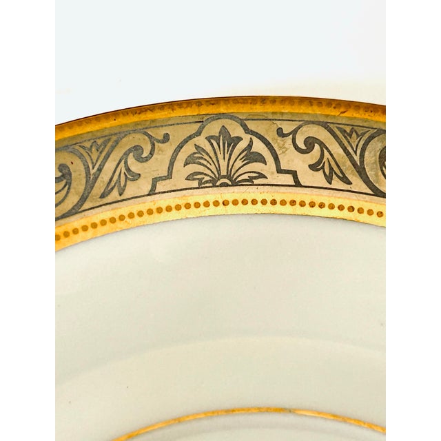 Orléans Breakfast Saucer by Deshoulieres. Crafted at the Limoges factory in France. The design features intricate gold and...