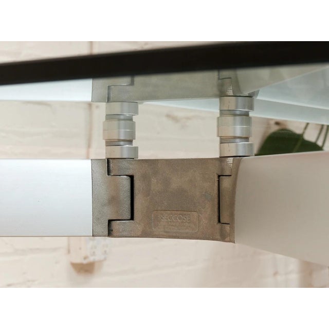 A striking Italian dining set designed by Mario Hasuike, featuring the Seccose glass dining table paired with six...