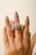 This Bochic wide band ring is crafted from high-quality 925 sterling silver and features vibrant green cubic zirconia in a...
