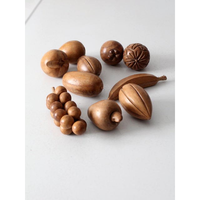 This vintage set of 10 carved monkey pod wood fruits brings warm, natural character to any space. The collection includes...