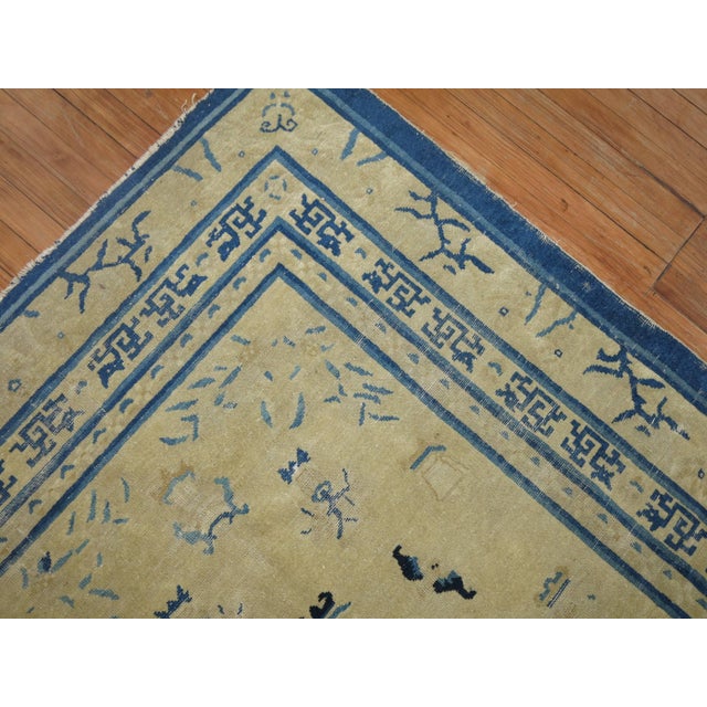 Rare size Chinese Peking rug in tan and blue, circa 1910, measures: 4'11" x 7'6" Peking rugs consist of designs that are...
