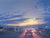 Going Home by Mark Harrison | Oil on linen Painting of cars driving at sunset on a city street For Sale