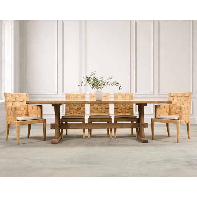 A large rustic French provincial farmhouse trestle dining table featuring a bleached oak finish measuring more than eight...