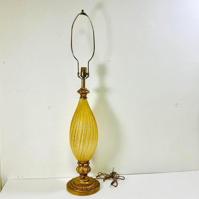 Vintage Home is pleased to present this vintage Italian Venetian glass table lamp. The lamp is tall at 27.5” from the base...