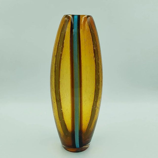 1970s Luxury handcrafted amber and blue vase in Murano glass by Maestro del Vetro. Made in Italy. The item is in excellent...