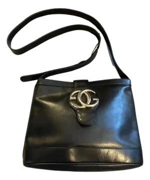 An Elegant 1970s Black Leather and Brass Bucket Shoulder Bag by Gucci