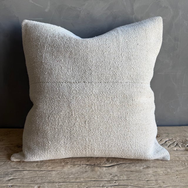 Creamy white hemp rug pillow with stripes. Soft hand, linen blend backing with zipper closure. Spot cleaning is...