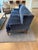 The Tasha wingback sofa by Mitchell Gold + Bob Williams in blue velvet with tapered wood legs and frame. This modern...