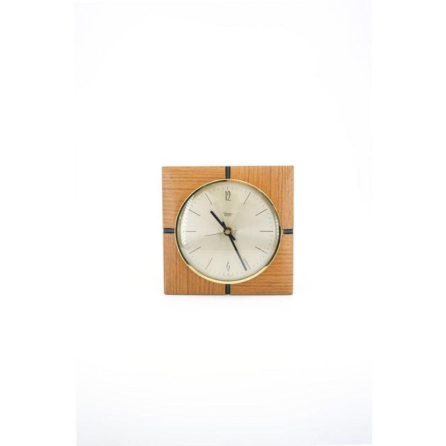 1960s wall clock in wood and brass, Diehl brand This piece has an attribution mark, I am sure that it is completely...