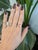 A 0.79-carat orange imperial topaz emerald-cut sits at the center of this solid 14K yellow gold ring, framed by two earth-...