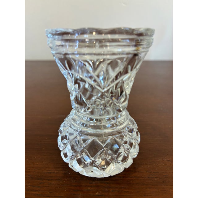 A delightful vintage pressed glass toothpick holder featuring a faceted diamond motif, pedestal base, and softly scalloped...