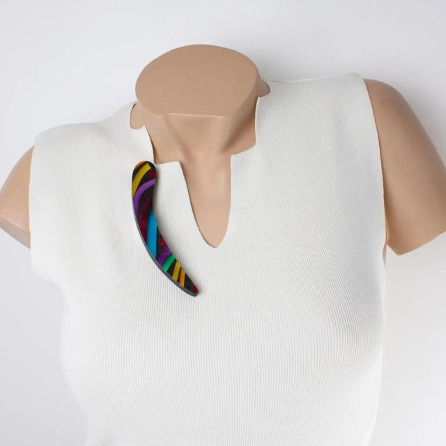 Harriet Bauknight designed this spectacular acrylic resin (Lucite) brooch for Kaso in the 1980s. The geometric "comma"...