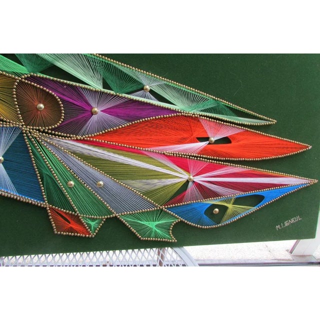 Magnificent motif representing a cockatoo, made of stretched threads, studded and signed M.Ligneul, contemporary of 1970,...