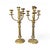 An elegant pair of early 20th-century brass candelabras featuring classic proportions and a beautifully aged patina....
