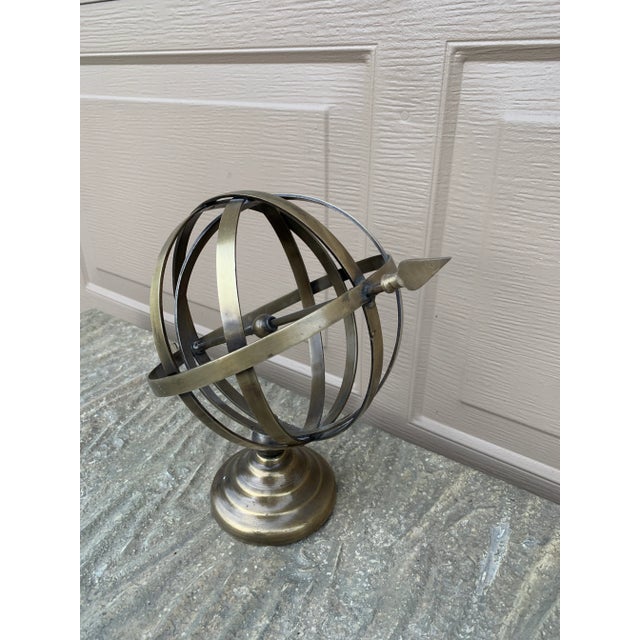 A beautifully crafted brass armillary sphere, evoking the timeless elegance of classical European gardens. Pieces like...