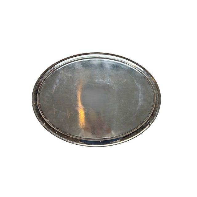 This Vintage Hotel Silver Oval Engine-Turned Tray is a durable, heavy-gauge silver-plated serving piece originally crafted...
