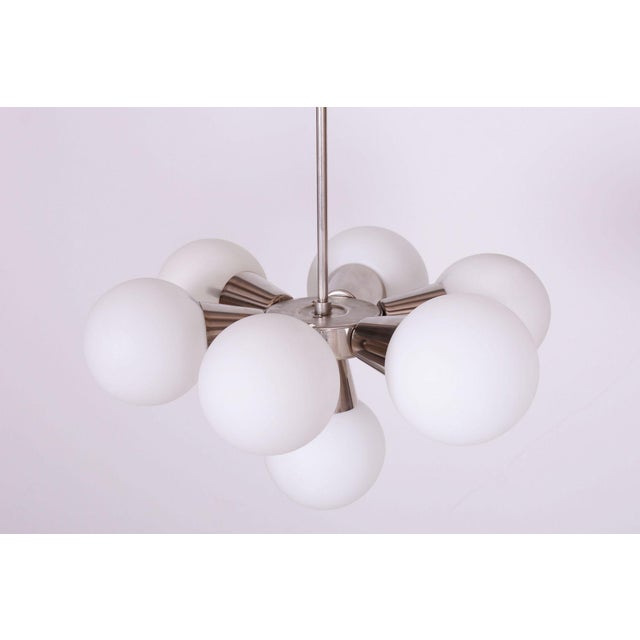 This Sputnik-style chandelier is an iconic representative of the Space Age and progressive 1970s Czechoslovak design....
