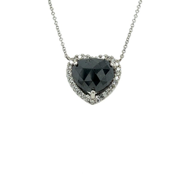 This beautiful necklace has a Natural Black Diamond that weighs 4.79 carats and also Natural Round Cut White Diamonds that...