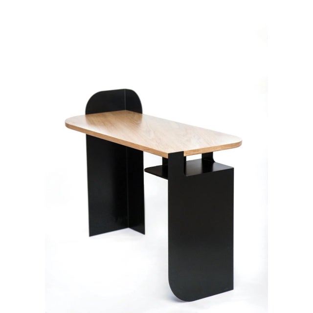 Metal & Wood is a desk or console table that is inspired by train shapes and Art Deco style architecture. A solid oak top...