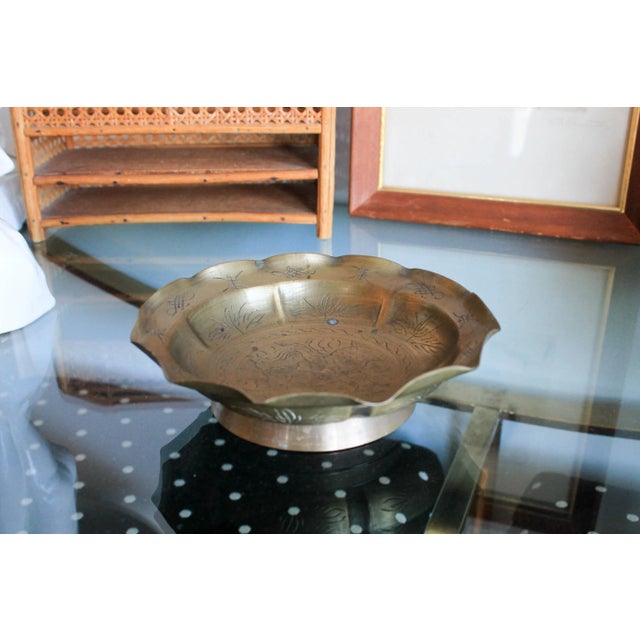 Vintage decorative brass bowl with etching and scalloped edges. Marked "China" on the bottom. Some age wear and patina.