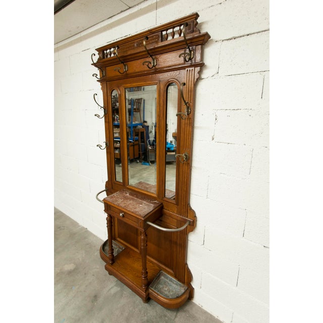 Napoleon III style walnut wardrobe, late 19th century, with 3 mirrors, marble top, and 8 hooks. It is in excellent...