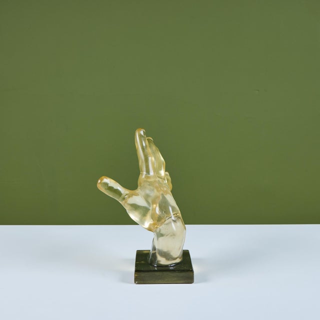 Dorothy Thorpe style mounted resin casting of a hand. This piece showcases a large hand sculpture in a reaching position....