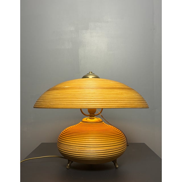 Gorgeously proportioned pencil reed rattan table lamp with brass with mushroom shade. This lamp is in great vintage...
