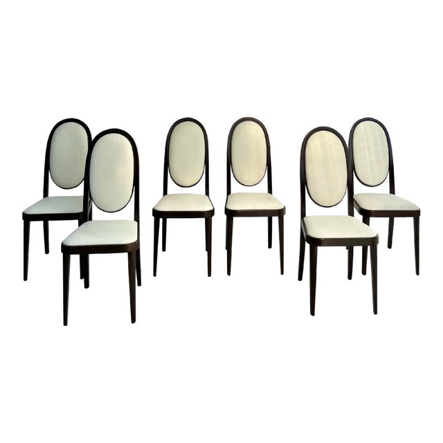 This beautiful set of ten dining chairs was designed by Otto Prutscher for Thonet and exemplifies the elegant balance of...