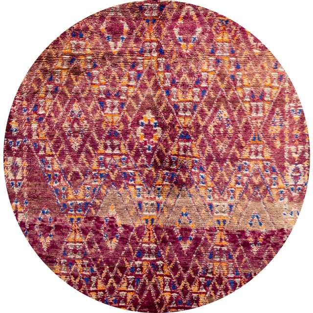 Beautiful Vintage Moroccan rug. This piece has an eggplant-purple field with a geometric design in intersecting diamonds....