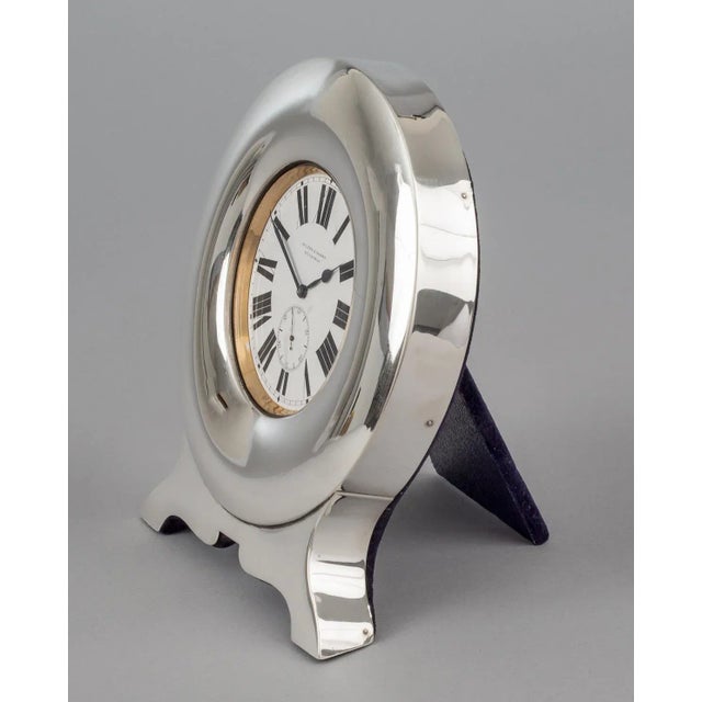 Edwardian large pocket watch in sterling silver case and stand. The dial is signed Wilson and Sharp, Edinburgh. It has an...