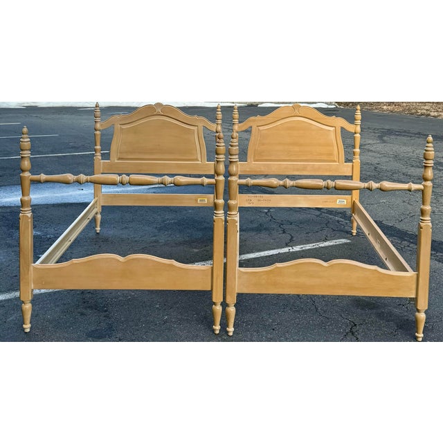 Charming pair of twin sized beds by Ethan Allen. These French style beds feature carved shell detail , turned posts and...